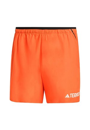 Orange athletic shorts made from lightweight fabric with an elastic waistband, featuring a black accent and white "TERREX" logo.