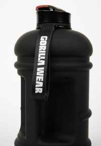 Black water bottle with textured grip, screw-top lid, red accent, and a fabric strap labeled "GORILLA WEAR."