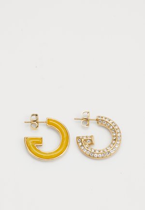 Gold-tone earrings featuring a yellow enamel circular design and a second crescent shape adorned with clear rhinestones.