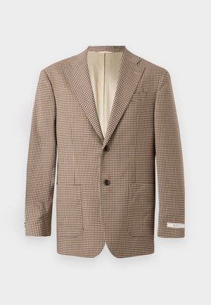 Barna és krém színű kockás blézer, hegyes gallérral, két elülső zsebből és két gombos záródásból áll, világosbarna béléssel.