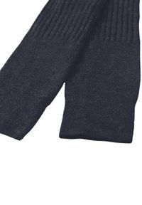 Calze nere lavorate a maglia con una texture a coste nella parte superiore e una finitura liscia sul piede, realizzate in un morbido tessuto misto.