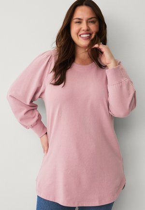 Pink long-sleeve pullover top with puffed sleeves, round neckline, and relaxed fit. Fabric appears soft, with ribbed cuffs and side hem slits.