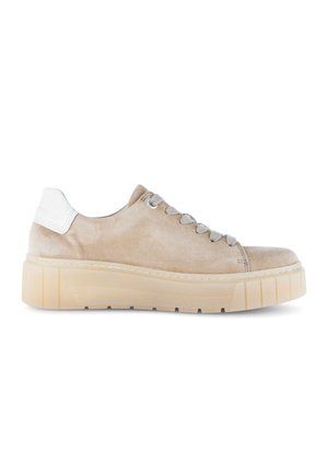 Beige suede low-top sneaker with thick translucent rubber sole, gray laces, and white heel patch, shown in right side profile.