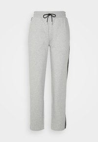 Grijze joggingbroek van zachte stof, met een elastische tailleband met een zwarte trekkoord en zwarte strepen langs de zijkanten van de benen.