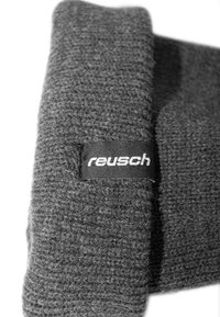 Gray knitted fabric with a ribbed texture; features a black label with the brand name "reusch" in white lettering.