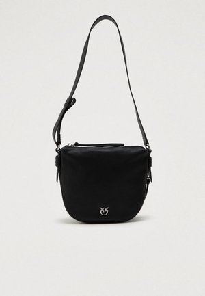 Black crossbody bag with adjustable strap, half-moon shape, zipper closure, and small silver logo emblem on front center.