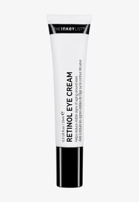 Förpackning med The Inkey List Retinol Eye Cream, 15 ml, med svart lock och text som anger att den minskar synliga ålderstecken runt ögonen.