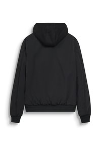 Giacca nera trapuntata con cappuccio, maniche lunghe e polsini e orlo a costine, vista da dietro su sfondo bianco.