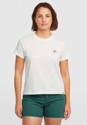White cotton t-shirt with short sleeves, featuring a round neckline and a small round logo on the left chest. Paired with green shorts.