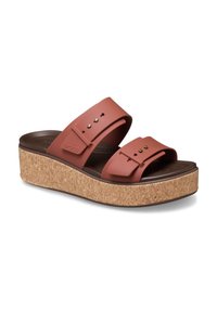Brown cork platform sandals with a two-strap design in terracotta, featuring small metal accents and a contoured footbed for comfort.