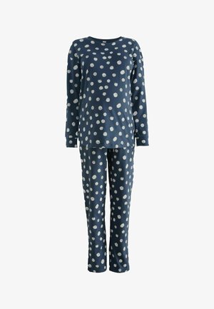 Navy Pyjama-Set aus weicher Baumwolle. Langärmeliges Shirt und Hose mit großen weißen Punkten. Lockere Passform mit rundem Halsausschnitt und elastischem Bund.