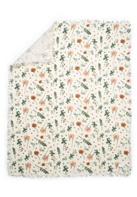 Floral patterned throw blanket with orange and green flowers on a cream background. Edges feature a white fringed trim. Soft, textured fabric.