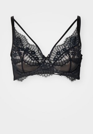 Brassière en dentelle noire avec des panneaux transparents, des bords festonnés et des bretelles réglables, ornée de motifs floraux et d'un design confortable.