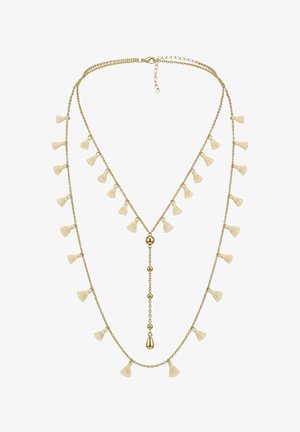 Collier superposé délicat ton or avec de petites pampilles crème le long des chaînes et une chute verticale ornée de perles dorées et d'un pendentif en forme de goutte.
