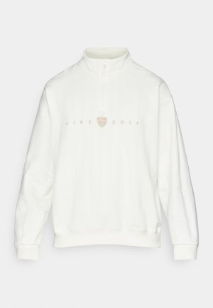 Λευκή ζακέτα γκολφ Nike, με ριγωτή υφή, μισό φερμουάρ στον γιακά, με μπεζ λογότυπο στο κέντρο μπροστά, χαλαρή εφαρμογή και ελαστικές μανσέτες.