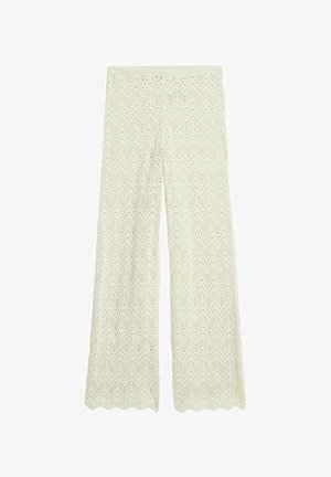 Valkoiset leveälahkeiset neulehousut, joissa on sahalaitakuviota, leikattuja yksityiskohtia ja aallotettu helma. Pehmeä, hengittävä materiaali sopii rentoon käyttöön.