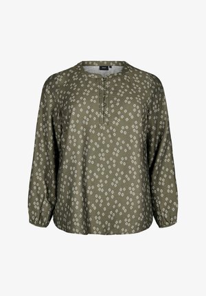 Zelena bluzica s vzorcem, okroglim izrezom, gumbasto zapenjanje in dolgimi rokavi. Ima beli elipsasti print po celotni površini.