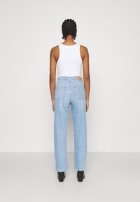 Weekday ROWE EXTRA HIGH - Calças de ganga de perna direita - light blue moise