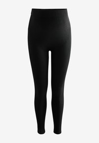 Leggings neri a coste con vita alta. Il tessuto è liscia con un design aderente, che si restringe alla caviglia senza cuciture visibili.