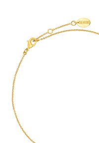 Złota bransoletka z zapięciem typu karabińczyk, z małą okrągłą zawieszką wygrawerowaną "GEMINI". Projekt łańcuszka ma małe, splatane ogniwa.