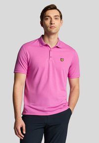 Pink polo shirt made of lightweight fabric with a classic collar, featuring a small yellow butterfly logo embroidered on the chest.