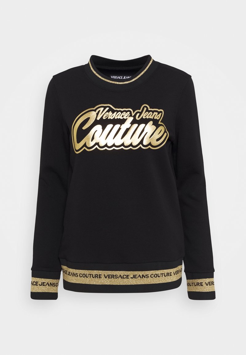 Sweat-shirt noir à manches longues avec logo doré "Versace Jeans Couture" sur la poitrine et poignets et ourlet bordés d'or avec texte de la marque répété.