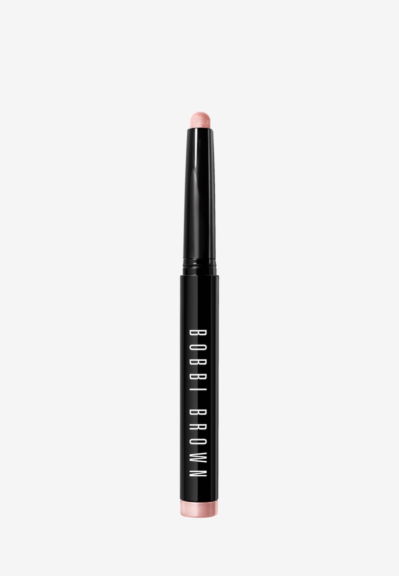 Bobbi Brown highlighterstick, cilindrische zwarte behuizing met witte letters, afgeronde top met een lichtroze, glanzende afwerking.