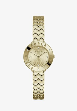 Montre dorée avec un bracelet tressé. Le cadran rond présente un fond texturé, un logo "FURLA" et quatre pierres décoratives.
