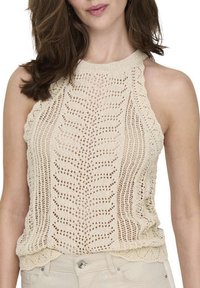 Débardeur en tricot beige doux, avec un motif de feuilles texturé, des bords festonnés et une coupe décontractée avec un col arrondi.