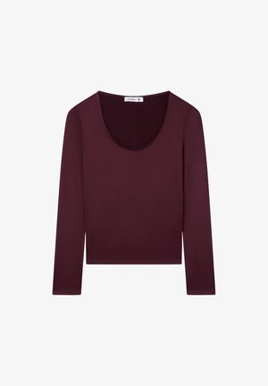 Maglietta a maniche lunghe di un profondo bordeaux, con scollatura rotonda e design aderente. Realizzata in tessuto liscio e elastico per il massimo comfort.