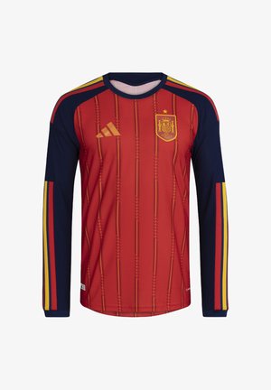 Červený dlhý rukáv jersey s námornícky modrými akcentmi, s horizontálnymi pruhmi a zlatým logom. Vyrobený z ľahkej, priedušnej látky.