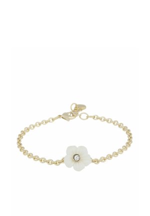 Gold chain bracelet with a small white flower charm featuring a central clear gemstone on a white background.