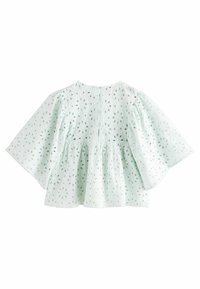 Blouse en coton vert menthe clair avec des manches cloche, broderie florale en œillets, taille froncée et fermeture à boutons au dos.