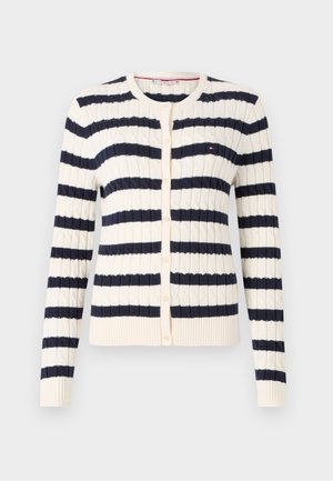 Triibuline kardigan kreemi- ja mereväe sinises, millel on tekstureeritud kudumise muster, ribidega mansetid ja ümmargune kaelus, millel on nööbid.