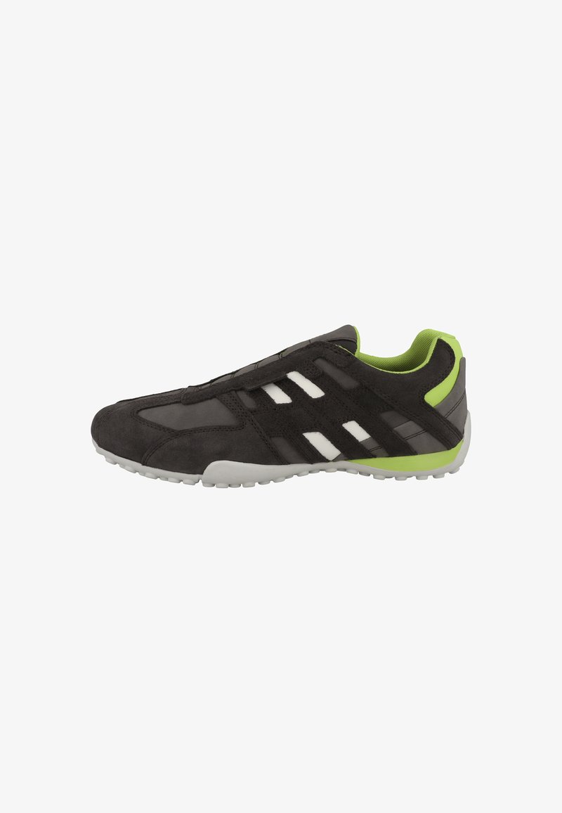 Black suede athletic shoe with a breathable mesh upper, green accents, white stripes, and a flexible rubber sole.
