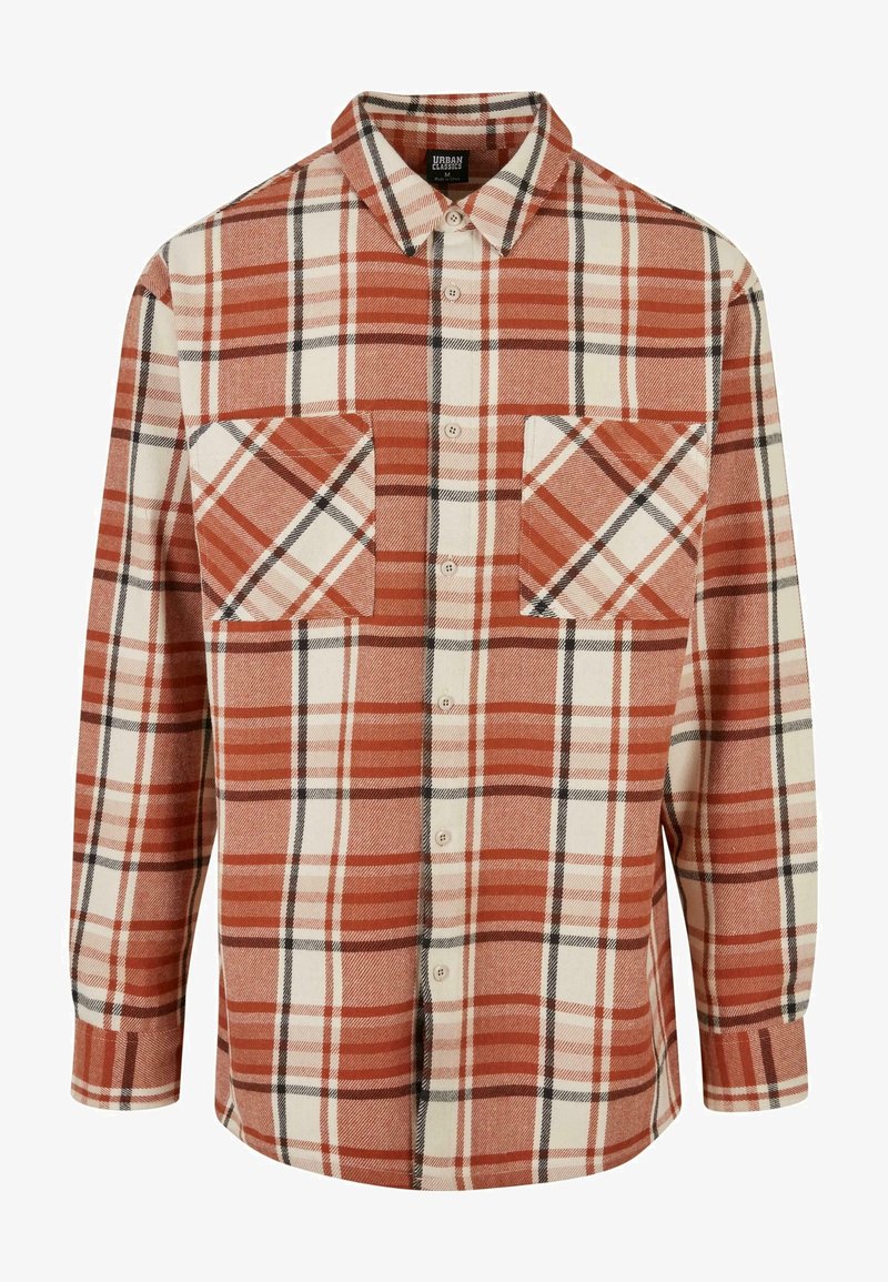Kostkovaná flanelová košile v odstínech rezavě-oranžové, krémové a černé. Obsahuje dvě náprsní kapsy a zapínání na knoflíky. Dlouhé rukávy s manžetami. Měkká textura.