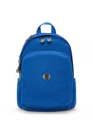 Blue nylon backpack with rounded shape, front pocket, double zipper closure, and logo badge. Features adjustable straps and side pockets.