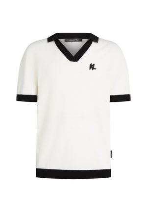 White knitted short-sleeve polo with a black V-neck collar and cuffs. Features a small black logo on the chest.