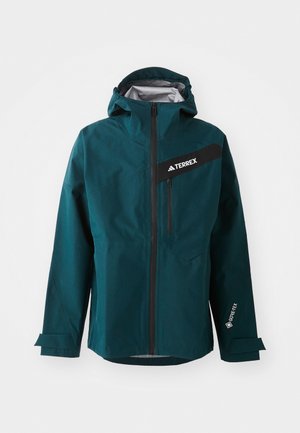 Teal waterdichte jas met een capuchon, ritsluiting, zwarte accenten en een logo. Voorzien van verstelbare manchetten en een voorzak met rits. GORE-TEX materiaal.