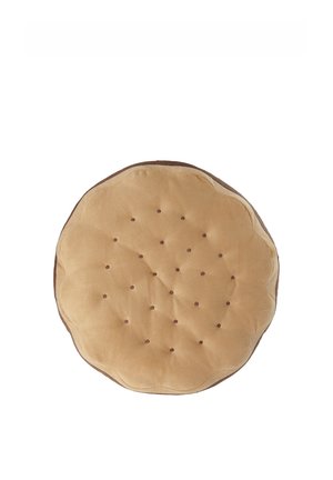 Round beige cushion with quilted dots, resembling a soft biscuit or cookie, against a white background.