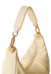 Cream-colored leather handbag with a gold chain and embossed strap. Features a zipper detail on one side and a soft, puffy silhouette.