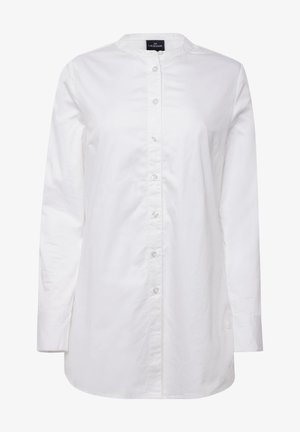 Bílá košile na knoflíky s dlouhými rukávy, kulatým límcem, přední léga a jemným leskem. Disponuje rovnými lemy a bočními rozparky pro větší pohodlí.