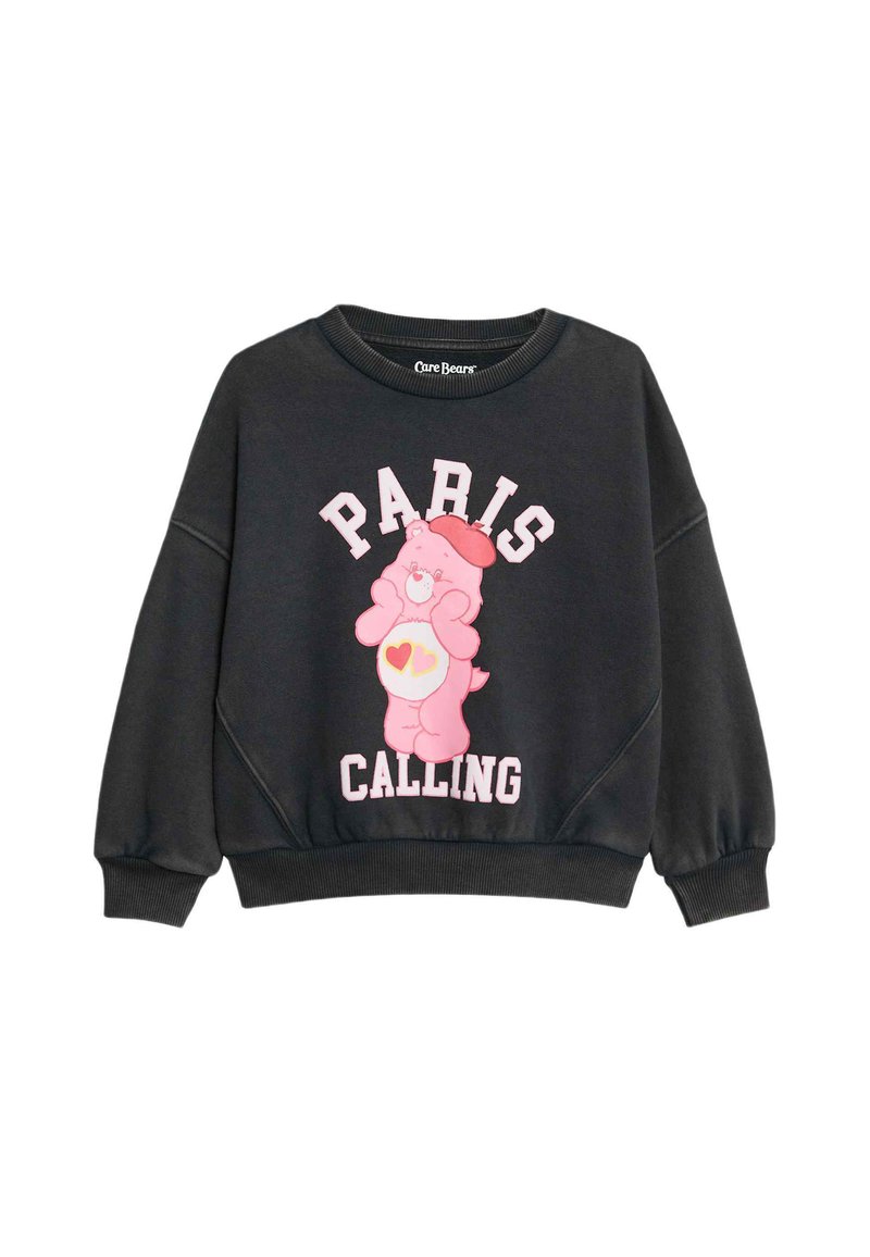 Svart sweatshirt med rund halsringning, med en rosa Care Bear-grafik och texten "PARIS CALLING" i vitt och rosa. Ribbad ärm- och nedkant.