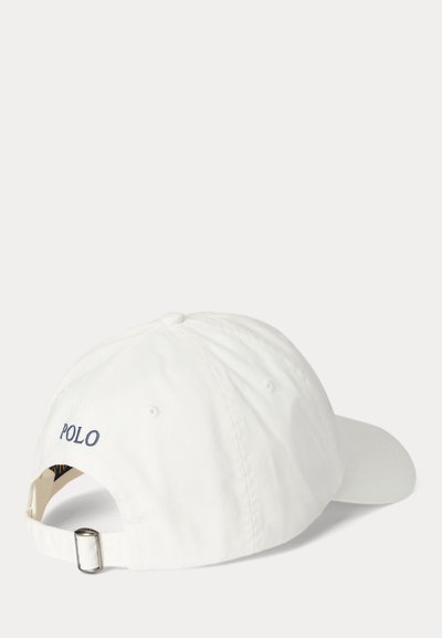 White baseball cap with adjustable metal buckle and "POLO" embroidered in dark blue on the back, shown at a rear angled view.