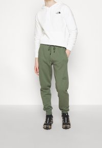 The North Face Träningsbyxor - dark green