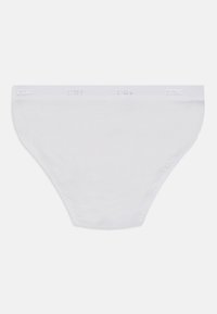 Culottes en coton blanc avec une texture lisse, dotées d'une taille élastique ton sur ton estampillée du nom de la marque sur le haut.