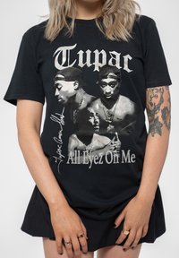 Black cotton t-shirt featuring multiple grayscale images of Tupac with "Tupac" and "All Eyez On Me" text in white and silver.