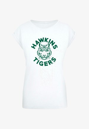 Fehér póló, rövid felgöngyölített ujjal, zöld tigrisarc grafikával és a "HAWKINS TIGERS" felirattal kör alakban.