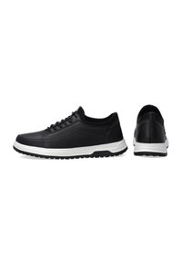 Black athletic shoes made of leather and mesh, featuring a lace-up design, white midsole, black textured outsole, and minimal stitching detail.