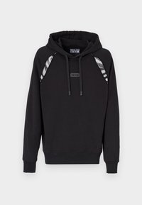 Haut à capuche noir avec des poignets et un bas côtelés, doté d'accents rayés gris sur les épaules et d'une étiquette logo à l'avant. Texture du tissu douce.